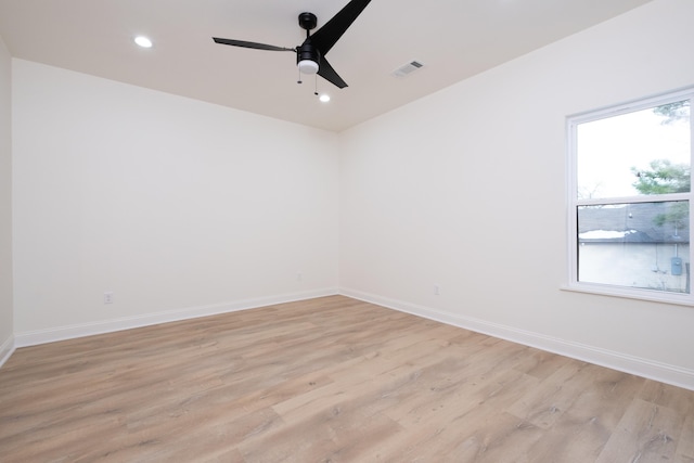 spare room featuring ceiling fan and light hardwood / wood-style flooring