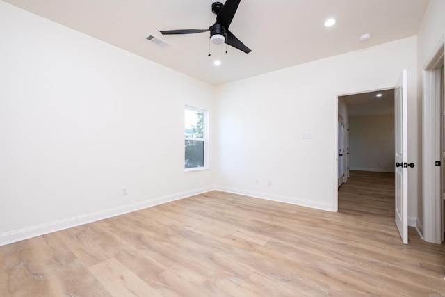 unfurnished room with ceiling fan and light wood-type flooring