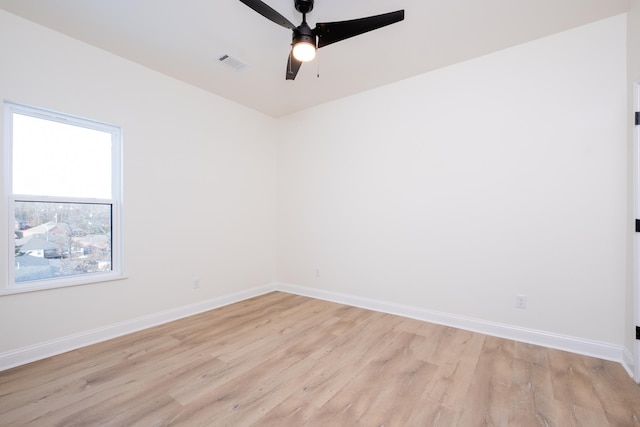 unfurnished room with ceiling fan and light hardwood / wood-style flooring