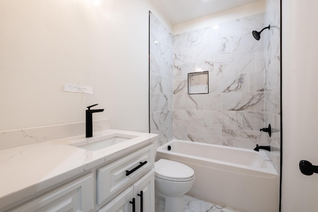 full bathroom featuring toilet, vanity, and tiled shower / bath