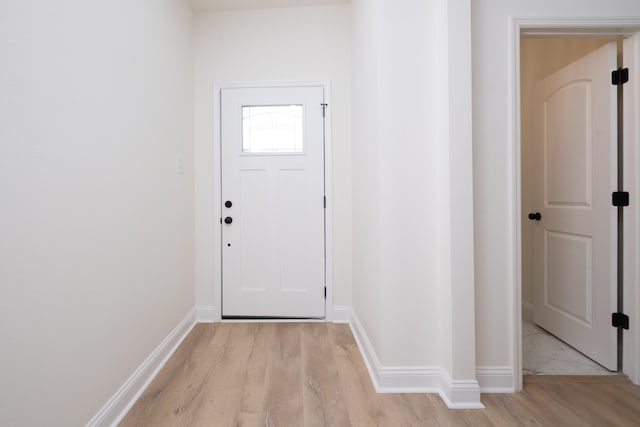 doorway with light hardwood / wood-style flooring