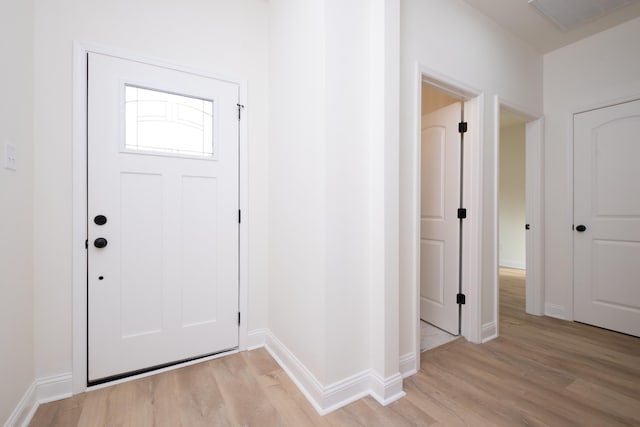 foyer with light hardwood / wood-style flooring