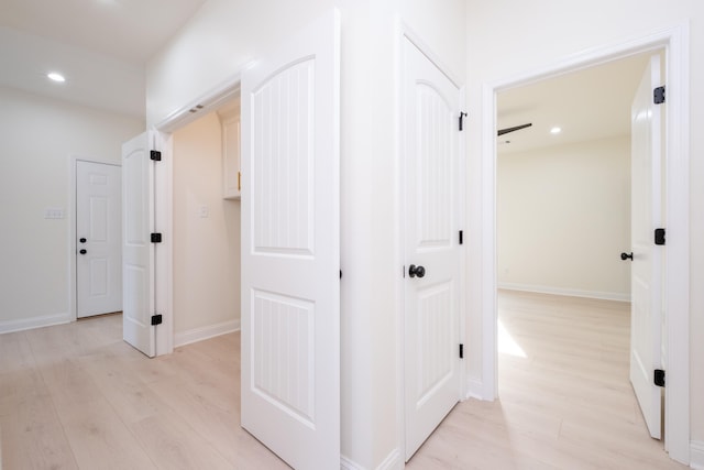 hall with light hardwood / wood-style floors