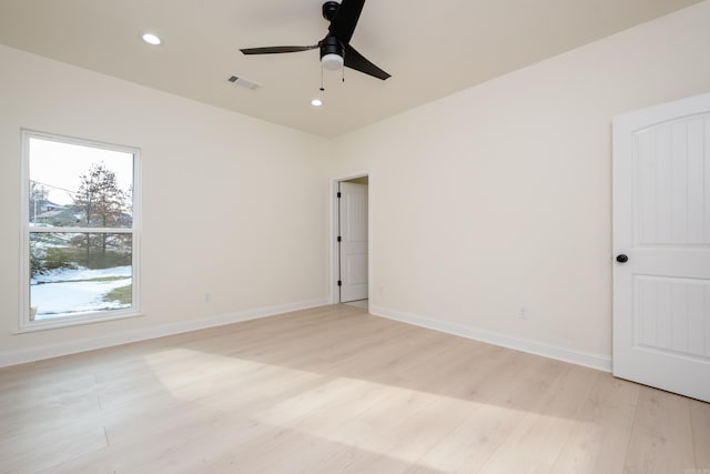 unfurnished room featuring ceiling fan and light wood-type flooring