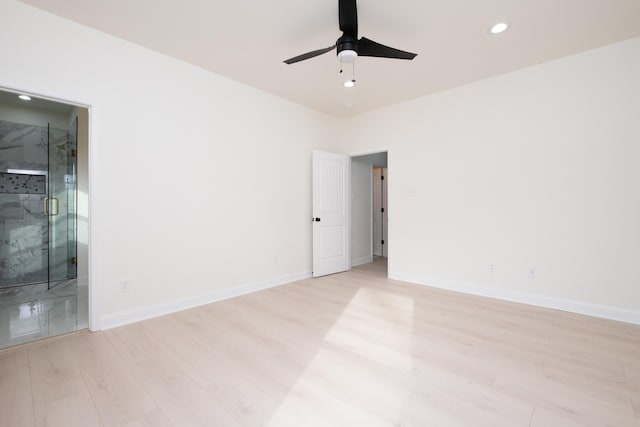 unfurnished room featuring ceiling fan and light wood-type flooring