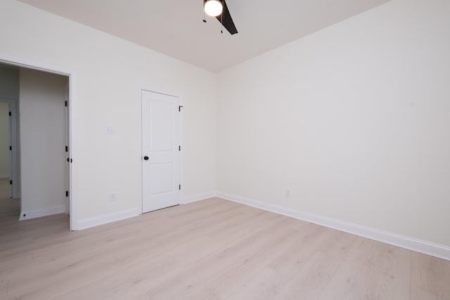 spare room featuring ceiling fan and light hardwood / wood-style floors