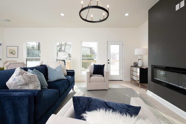 living room with an inviting chandelier