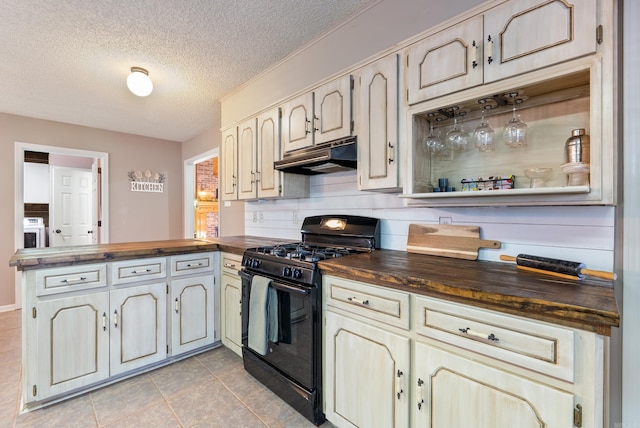 kitchen featuring a textured ceiling, wood counters, black range with gas cooktop, kitchen peninsula, and light tile patterned floors