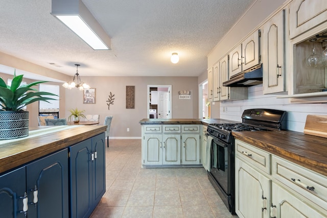 kitchen featuring decorative light fixtures, wooden counters, black gas stove, and a notable chandelier