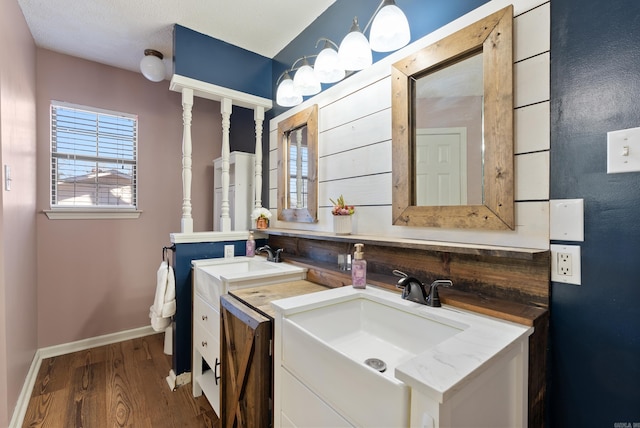 bathroom with hardwood / wood-style flooring and vanity