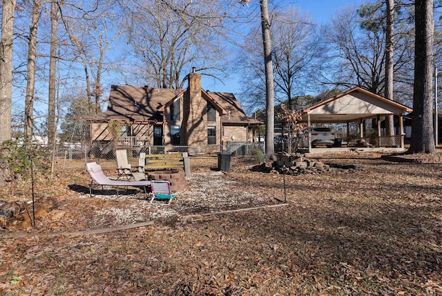 rear view of property with a gazebo