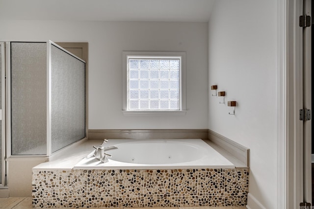 bathroom with tiled tub