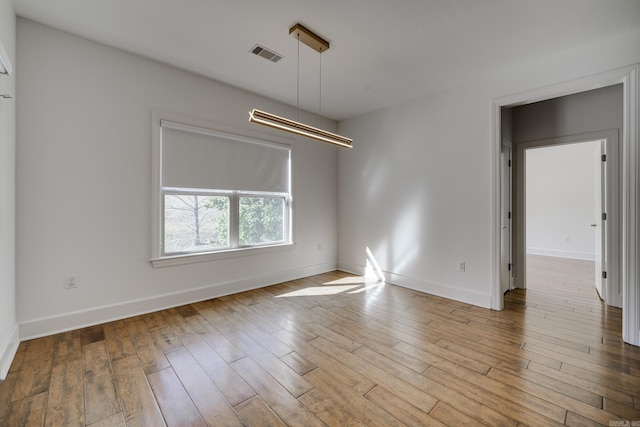 unfurnished room featuring light wood-type flooring