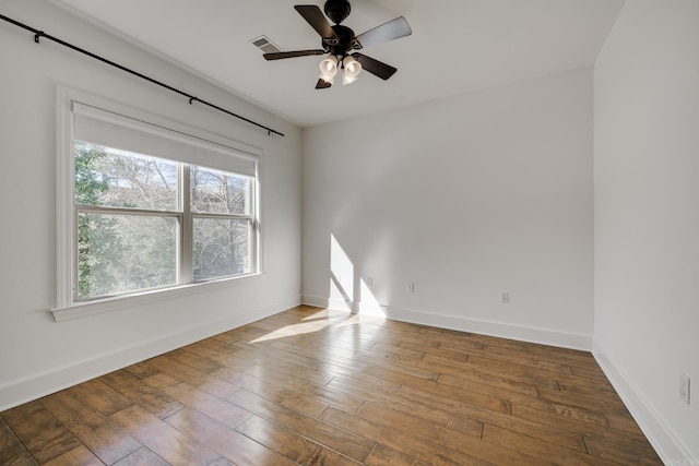 spare room featuring ceiling fan and hardwood / wood-style floors