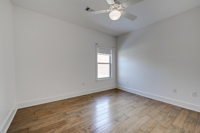 spare room with ceiling fan and hardwood / wood-style floors