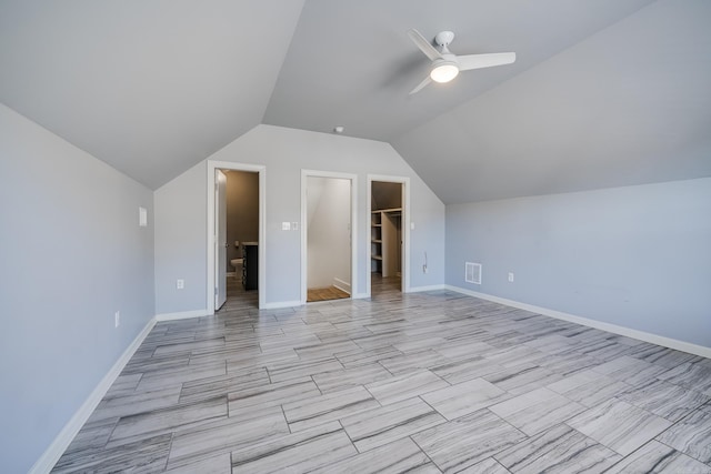 additional living space featuring vaulted ceiling and ceiling fan