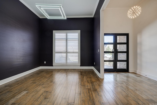 foyer entrance featuring hardwood / wood-style flooring, a wealth of natural light, and french doors