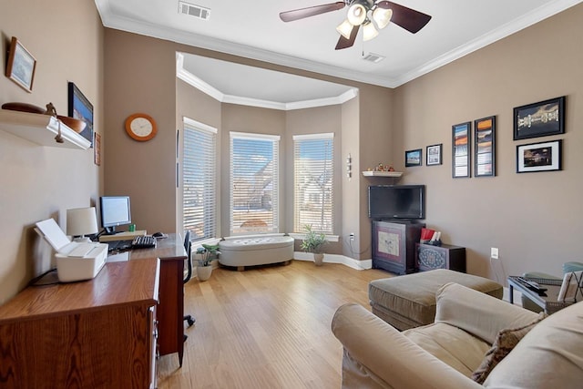 office area featuring ceiling fan, light hardwood / wood-style flooring, and ornamental molding