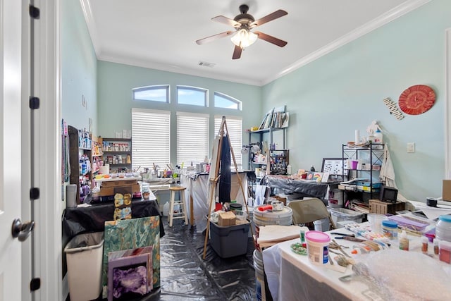 misc room featuring ceiling fan and ornamental molding