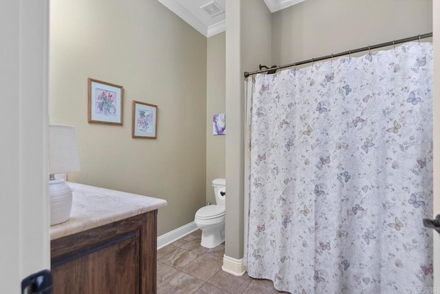 bathroom with toilet, crown molding, tile patterned floors, and vanity