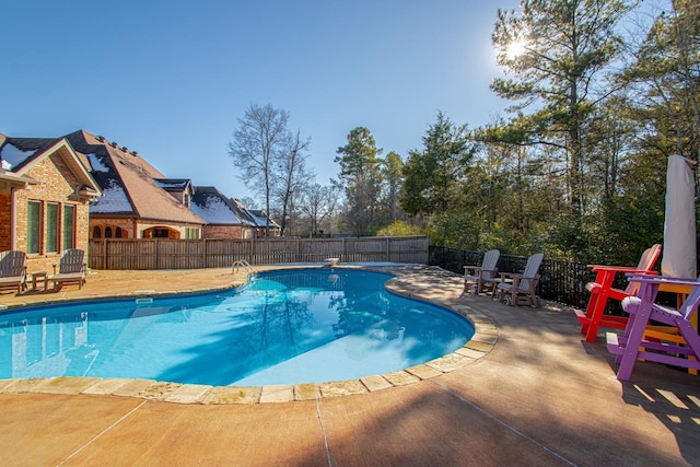 view of swimming pool featuring a patio