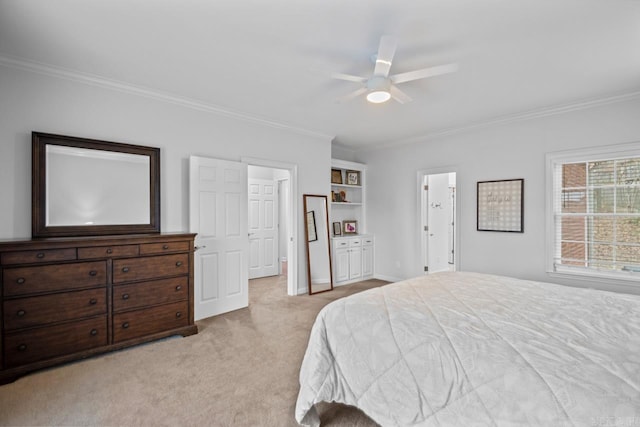 carpeted bedroom featuring crown molding and ceiling fan