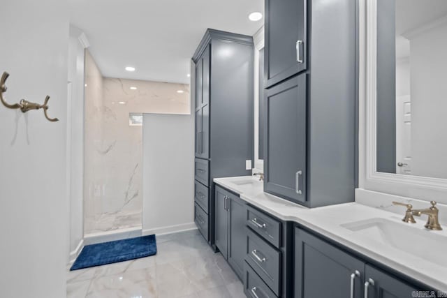 bathroom with vanity and tiled shower