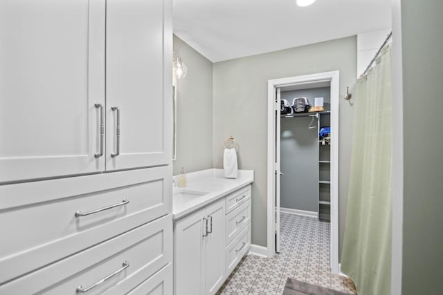 bathroom featuring vanity and curtained shower