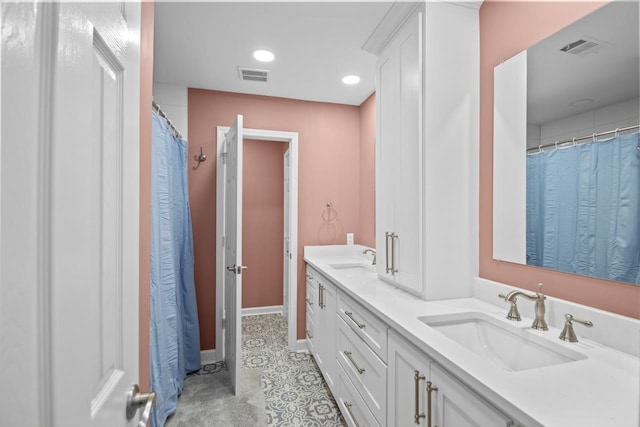 bathroom with vanity and tile patterned floors