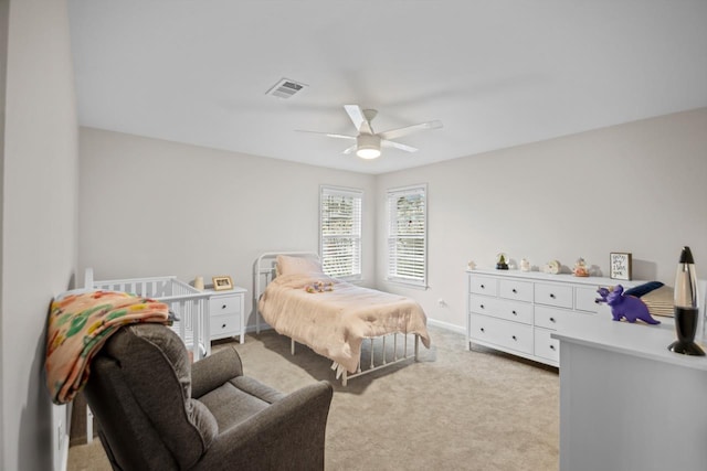 bedroom with light colored carpet and ceiling fan