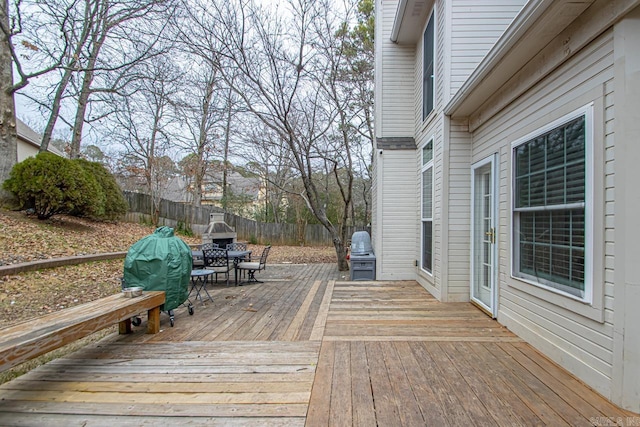 wooden terrace with area for grilling