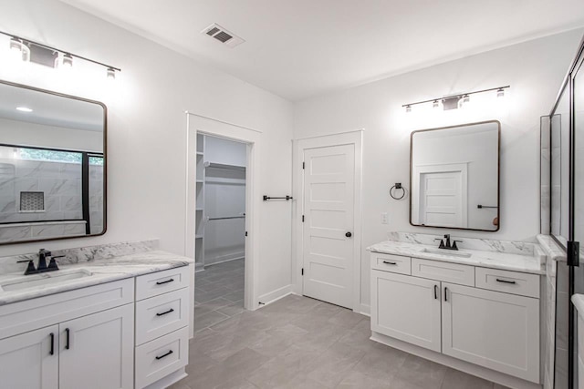 bathroom with vanity and tile patterned flooring