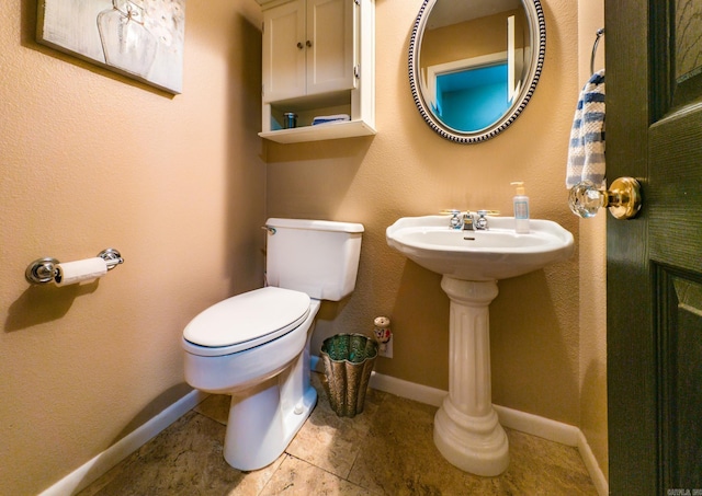 bathroom featuring toilet