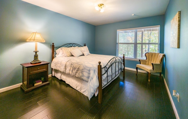 bedroom featuring dark wood-type flooring