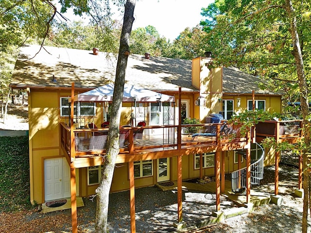 view of playground with a wooden deck