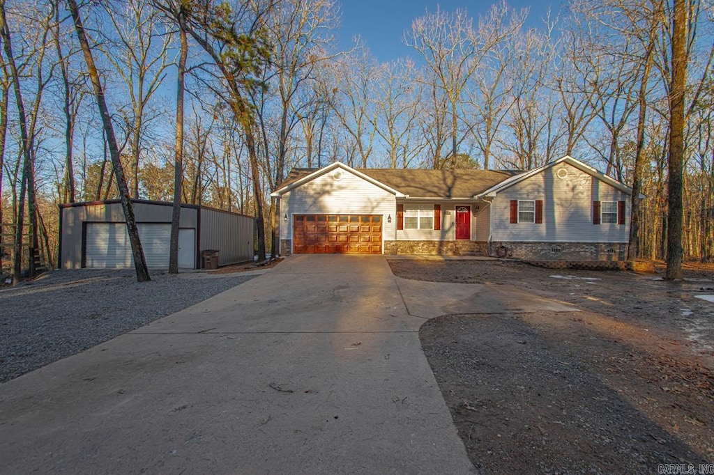 view of front of house featuring a garage and an outdoor structure