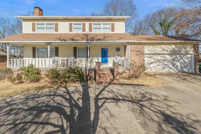 view of front of property with a garage and a porch