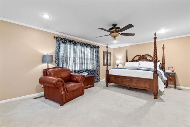 carpeted bedroom with ceiling fan and crown molding