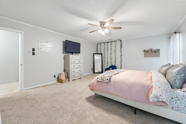 bedroom with ceiling fan, ornamental molding, and a textured ceiling