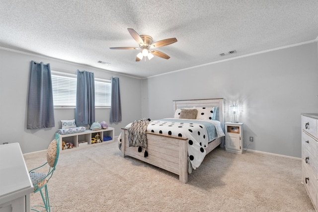 carpeted bedroom featuring ceiling fan, a textured ceiling, and ornamental molding