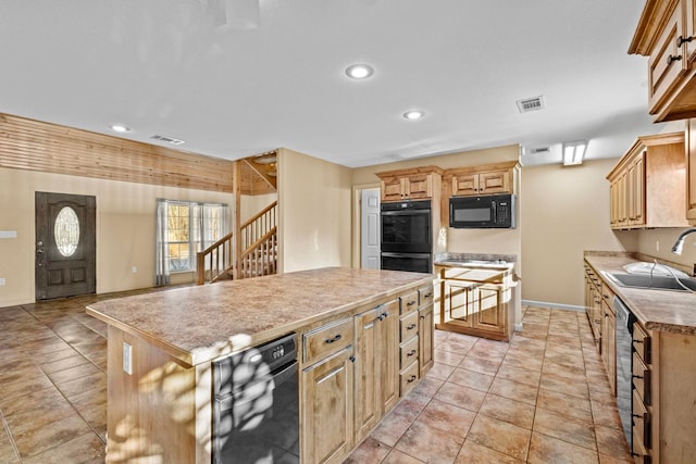 kitchen with light tile patterned floors, light brown cabinetry, a kitchen island, black appliances, and sink