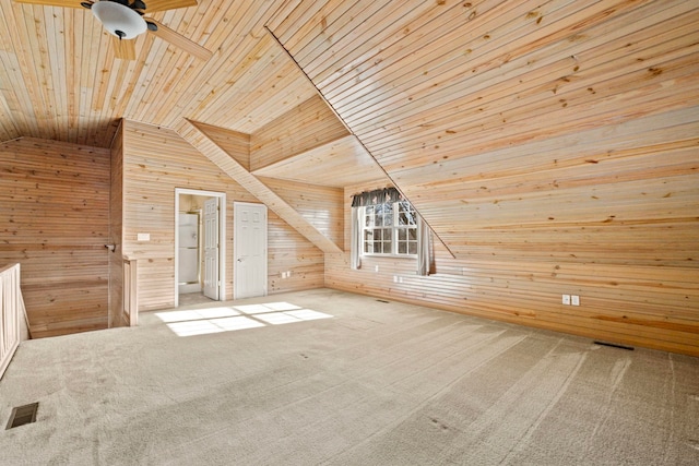 bonus room with lofted ceiling, wood ceiling, carpet floors, and wooden walls