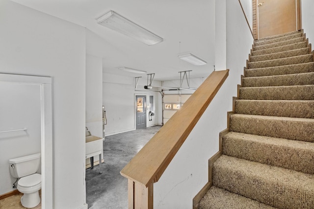 stairway with concrete floors