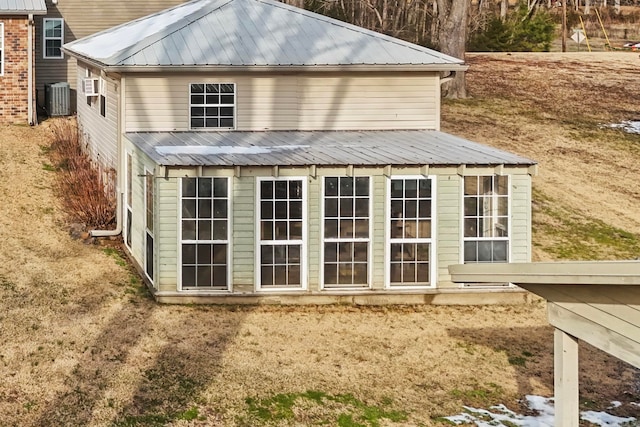 back of property with central AC