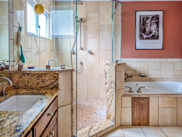 bathroom with vanity, tile patterned flooring, and shower with separate bathtub