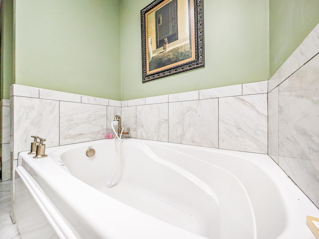 bathroom with tiled tub