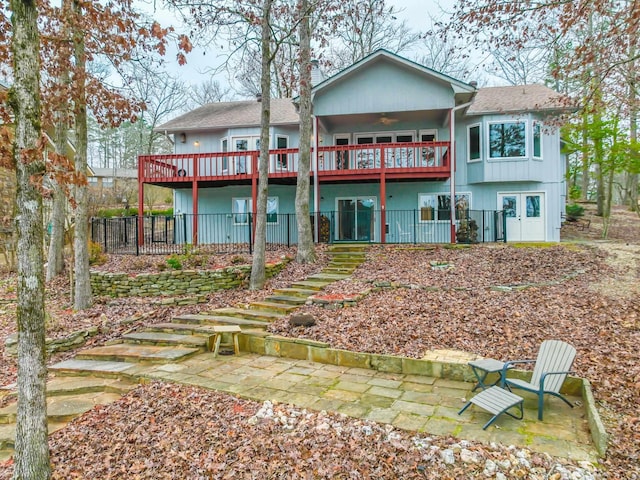 back of property with a patio and ceiling fan