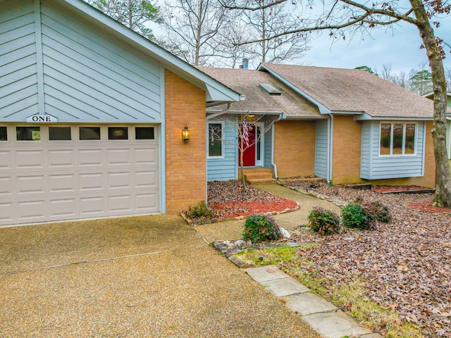 single story home featuring a garage