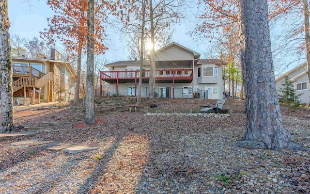 back of property featuring a deck