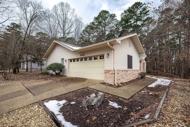 view of side of property featuring a garage